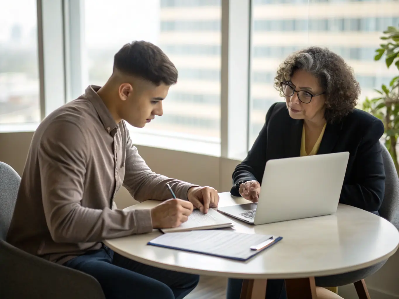 A supportive image of a coach guiding a woman through a business strategy session, emphasizing mentorship and personalized support.